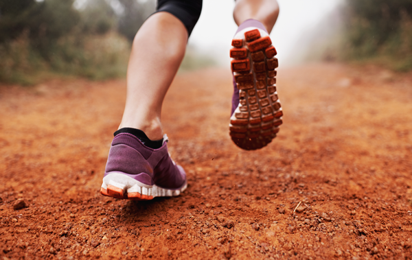 Picture of calves portion of a runner on dirt to show endurance